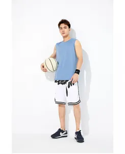 Detail view of a light blue quick-dry breathable basketball training vest on an Asian model