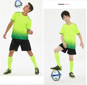 Close-up detail of neon green gradient soccer jersey set for adults and children training