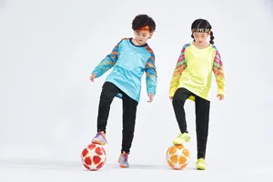 Full view of kids professional soccer goalkeeper training jerseys and black pants
