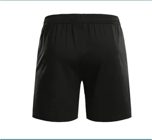 Back view of plain black unisex athletic sports shorts with comfortable elastic waistband