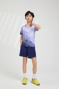 Full body view of boys purple gradient badminton sportswear set on Asian model.