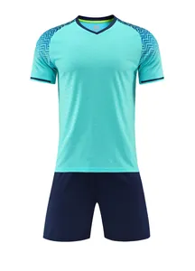 Front view of turquoise football jersey and navy shorts set with geometric sleeve pattern