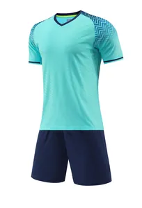 Detailed product view of a light blue soccer jersey and navy shorts sports kit for training