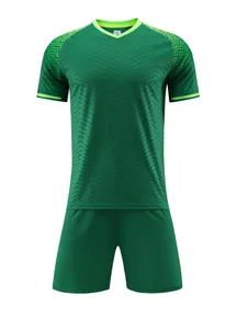 Close-up of green soccer jersey set featuring chevron pattern and lime green accents