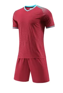 Detail view of burgundy soccer jersey set with light blue accents and V-neckline