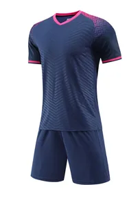 Detailed view of navy blue and pink soccer jersey set with stylish chevron pattern.