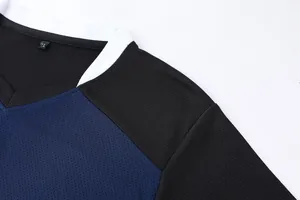 Close-up of the breathable mesh fabric and V-neck collar of a quick-dry sports jersey