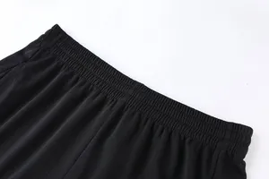Detail of elastic waistband on breathable black mesh athletic shorts