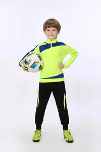 Fußball-Trainingsanzug für Kinder mit einer leuchtend gelben Sportjacke und Hose
