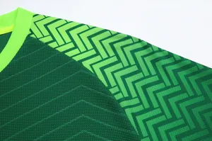 Detailed macro view of professional green football jersey fabric with geometric pattern