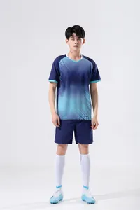 Full-body view of male sports jersey set in blue gradient pattern and navy shorts.