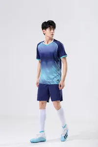 Full body shot of a male model wearing a blue gradient sports training kit set