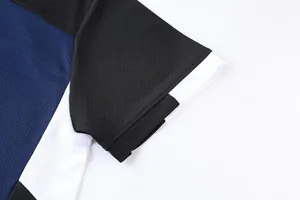 Detail view of quick-dry sports jersey showing breathable mesh fabric and color blocking.