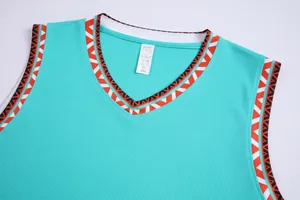 Detail view of teal basketball jersey featuring V-neck and mesh breathable fabric