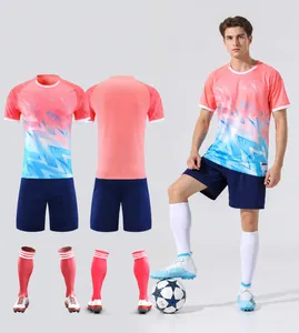 Pink soccer jersey set with gradient geometric patterns, full kit view with socks