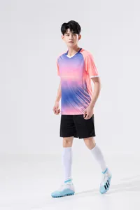 Full view of men's pink gradient sports training suit with black shorts and socks