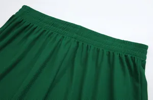 Close-up of green waffle-knit fabric detail on sports soccer jersey waistband