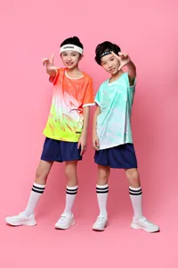 Detail of children wearing breathable orange and cyan summer football jersey kits