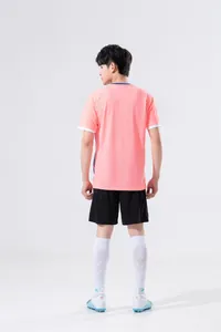 Back view of a men's athletic training set featuring a pink jersey and black shorts