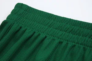 Close-up detail of dark green waffle textured waistband on football training shorts