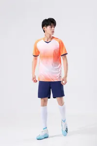 Men's athletic training set featuring an orange gradient jersey and navy shorts
