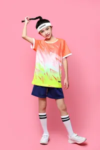 Full view of vibrant orange and yellow gradient soccer uniform set for children and youth.