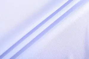Detailed close-up view of breathable white mesh fabric material for sports basketball jersey