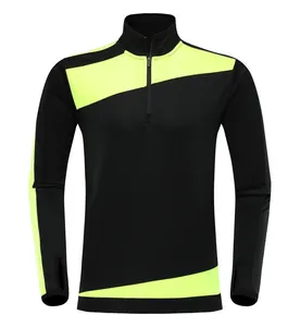 Schwarze und neongelbe langärmlige Fußball-Trainingsjacke mit Reißverschluss und Daumenlöchern