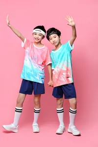 Close-up full body view of kids wearing pink and blue gradient football sports uniforms