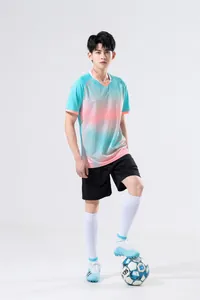 Close-up detail of men's sports training suit with cyan and pink gradient jersey