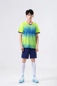 Professional full view of men's football training set with gradient jersey and navy shorts