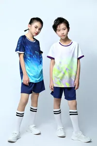 Youth athletic soccer uniform set featuring geometric gradient prints and sports shorts