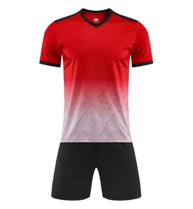 Detailed view of red and white gradient soccer jersey set with matching black shorts