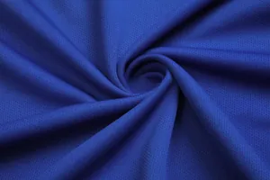 Macro detail of royal blue breathable mesh fabric for student football jerseys