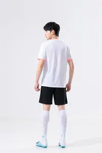 Back view of men's white sports training t-shirt and black shorts in professional studio