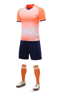 Professional soccer training set with orange gradient jersey navy shorts long socks and cleats