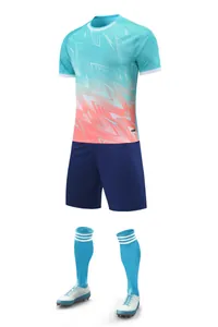 Short sleeve soccer uniform set with teal gradient jersey and navy blue shorts