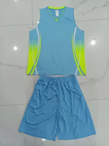 Flat lay view of blue basketball jersey set with neon green accents on floor