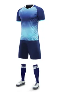 Close-up of navy and light blue soccer uniform set including jersey, shorts, and socks