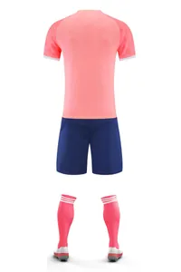 Back view of summer football uniform set featuring pink jersey, navy shorts and socks
