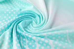Macro detail of breathable mint green gradient training sportswear fabric with white dots