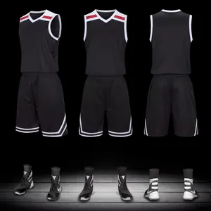 Detailed view of the black basketball jersey and shorts set with red and white trim.