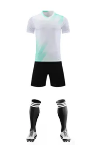 Full soccer kit including white jersey with teal stripes, black shorts, and socks