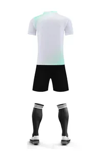Back view of white and black soccer training kit with mint green gradient detail
