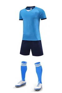 Complete soccer kit with light blue jersey, navy shorts, socks, and football cleats