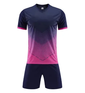 Navy blue and pink gradient soccer jersey set with chevron patterns