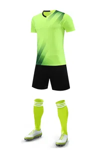 Detailed layout of a neon green soccer uniform with jersey, shorts, and socks