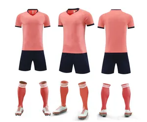 Comprehensive view of pink and navy soccer training kit with jersey, shorts and socks
