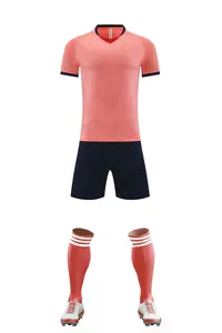 Full pink and navy soccer uniform set including jersey shorts socks and cleats