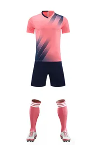 Full soccer training kit featuring pink jersey, navy shorts, and matching socks.